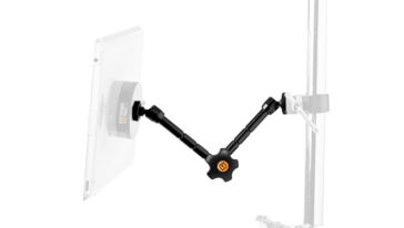 Smartphone mounted on a black multi-joint articulating arm attached to a vertical stand, viewed from the side.