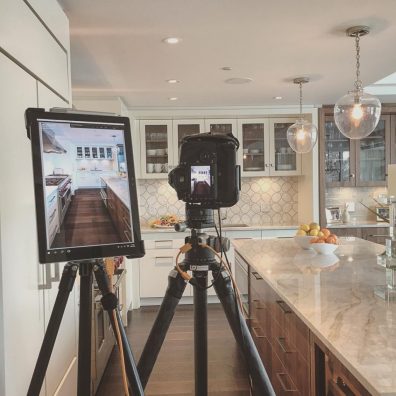 A setup in a kitchen where a tablet is displaying the image captured by the camera next to it