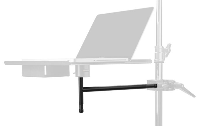 Laptop mounted on an adjustable boom arm attached to a vertical stand for a desk setup