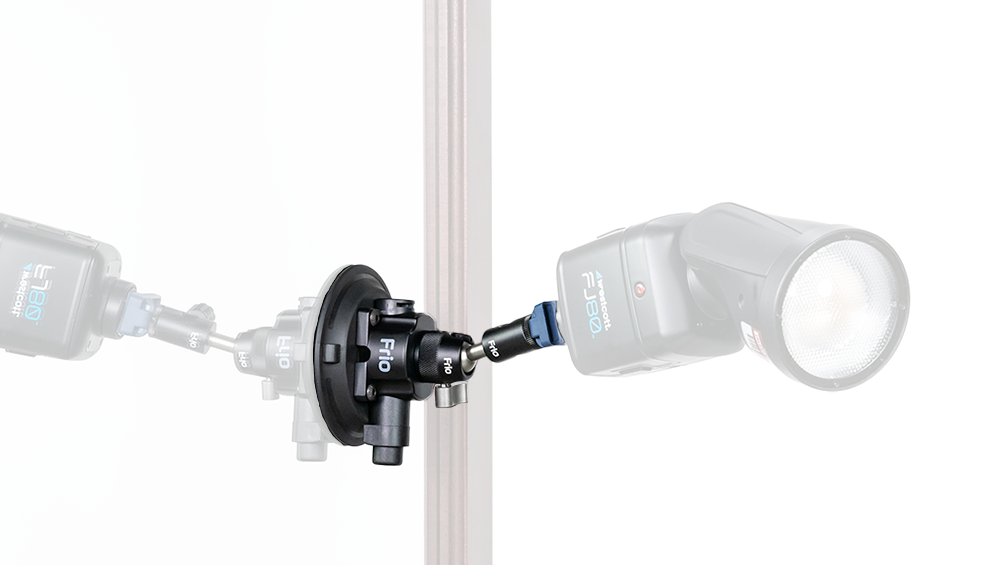 Two studio strobes mounted on a central clamp around a vertical stand, facing outward symmetrically.