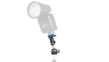 Westcott FJ80 studio flash head mounted on a light stand with accessories for a photography setup
