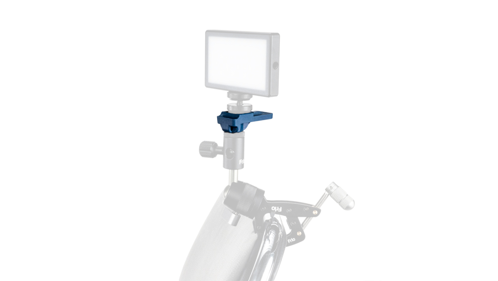 Rectangular LED light panel mounted on a blue clamp attached to a bike accessory for portable lighting