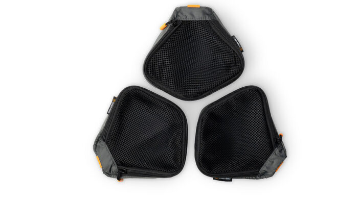 Three black mesh zippered pouches arranged in a triangular layout with orange zipper pulls and gray edges.